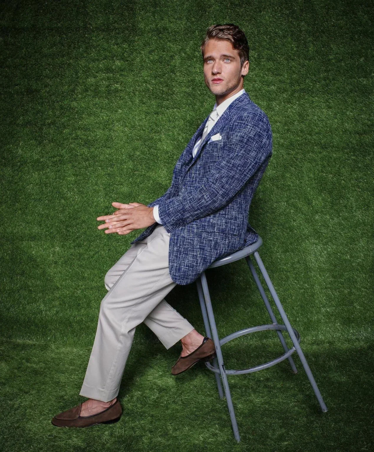Tailor measuring a suit